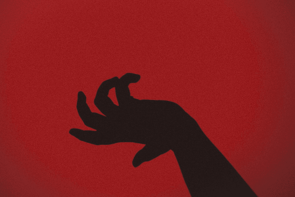 A person’s hand signifying homicide