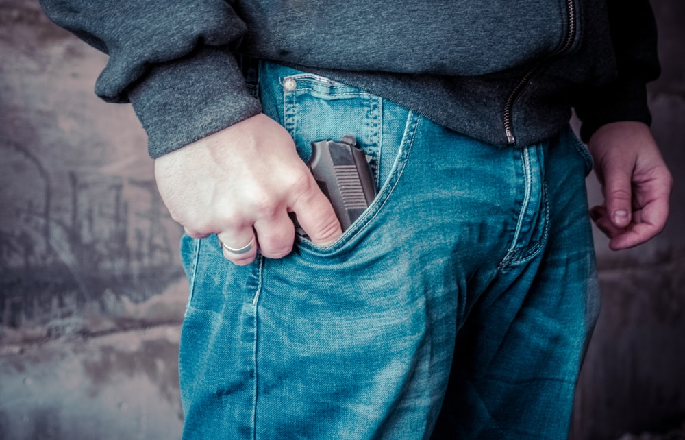 A man with a gun in his pocket