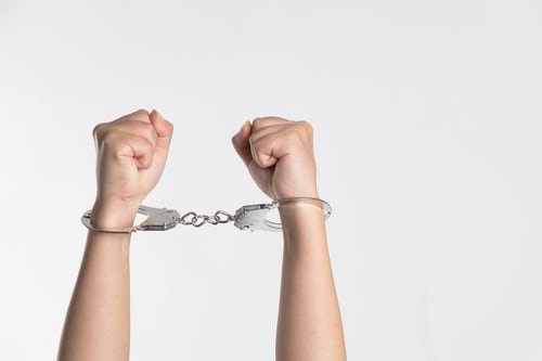 A person wearing handcuffs