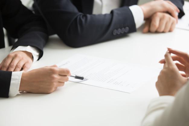 A person looking at documents with a bilingual criminal defense attorney in Tijuana, Mexico