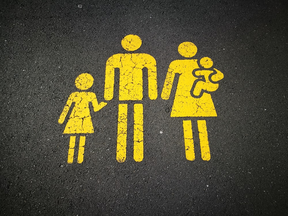 A road sign depicting a family